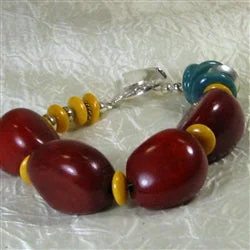 Vintage-inspired lace necklace for women with intricate detailing and classic appeal -Eclectic Bracelet in Maroon  Tagua nuts and Turquoise Kazuri Beads